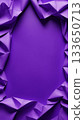 Crumpled purple fabric frame on solid background with empty center. Abstract textile border with copy space for design. 133650713