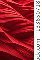 Abstract red fabric waves with soft folds and textures, elegant textile vertical background perfect for design, fashion, or festive themes. 133650718