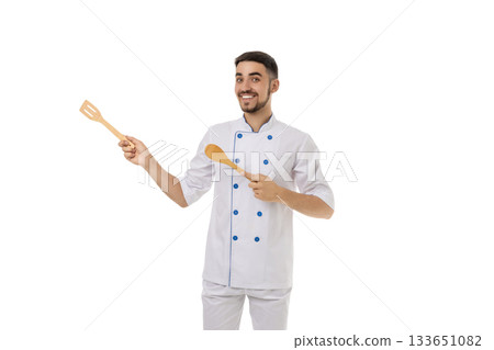 Chef smiles, holding spatula and spoon, isolated on white, PNG Chef smiles, holding spatula and spoon, isolated on white, PNG 133651082