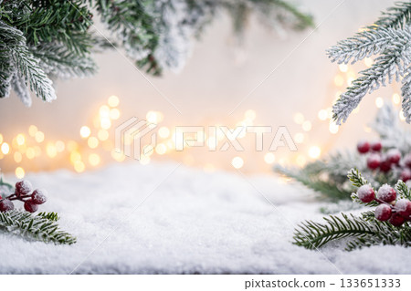 Snowy Pine Branches and Berries with Warm Holiday Lights Snowy Pine Branches and Berries with Warm Holiday Lights 133651333