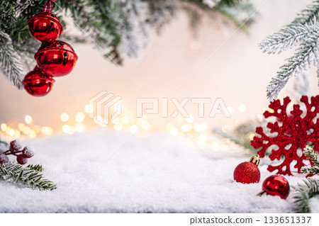 Red Christmas Ornaments on Snow with Frosted Pine Branches 133651337