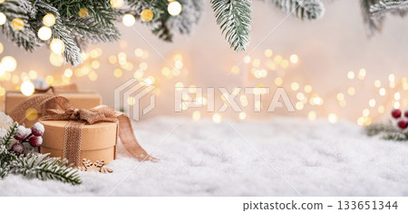 Rustic Gift Boxes on Snow with Frosted Pine and Warm Lights Rustic Gift Boxes on Snow with Frosted Pine and Warm Lights 133651344
