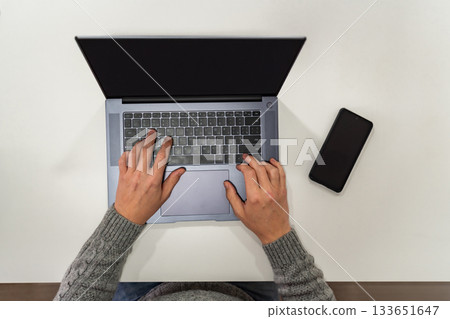 Top view, male hands using laptop 133651647