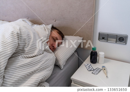 Man has fever and common cold Man has fever and common cold 133651650