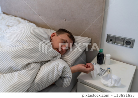 Man has fever and common cold Man has fever and common cold 133651653