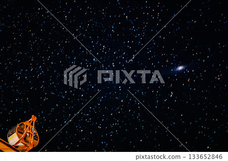 A fantastical scene of a Ferris wheel against the backdrop of the night sky 133652846