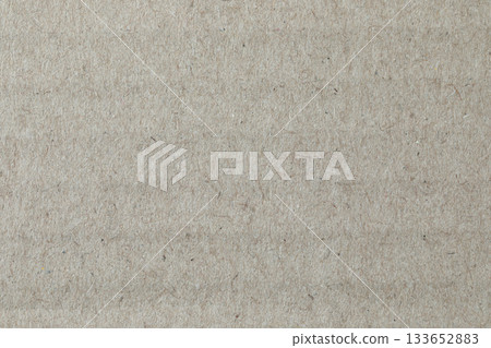 Kraft paper texture, macro close-up. Natural, warm, fibrous surface suitable for use as a background in design and craft projects 133652883