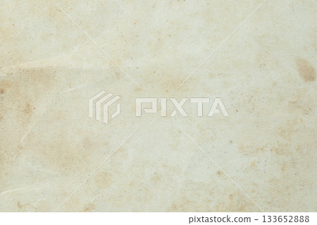 Macro texture of ancient book paper with aged fibers and natural wear. Warm vintage surface ideal for backgrounds, antique themes, history, design and creative projects 133652888