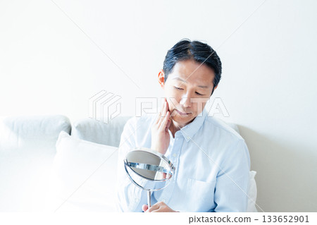 Mature men looking at mirrors Mature men looking at mirrors 133652901