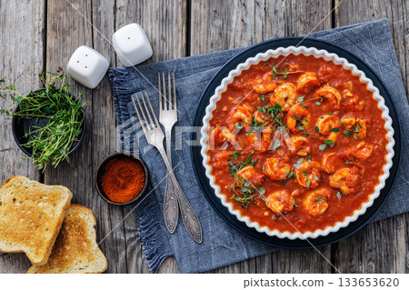 Shrimp in hot tomato sauce with garlic, onion 133653620