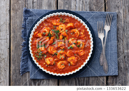 Shrimp in hot tomato sauce with garlic, onion 133653622