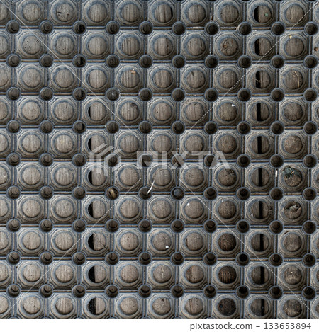 Holes rubber door mat for wiping foot with round holes texture asbtraction Holes rubber door mat for wiping foot with round holes texture asbtraction 133653894