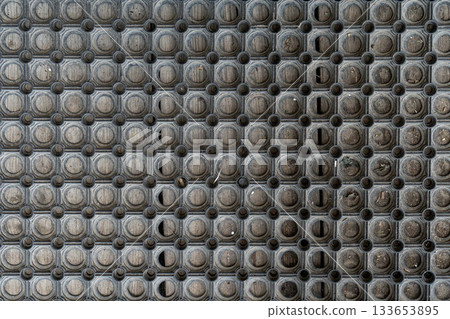 Holes rubber door mat for wiping foot with round holes texture asbtraction Holes rubber door mat for wiping foot with round holes texture asbtraction 133653895