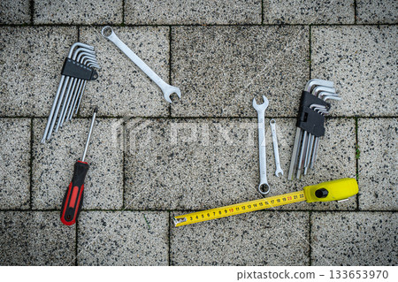 Greeting card of Fathers day. Flat set tools on stone pavement background Greeting card of Fathers day. Flat set tools on stone pavement background 133653970