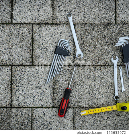 Various repair tools. Must-have for men. Equipment for building. Repair tool kit. Grey background top view pattern copy space Various repair tools. Must-have for men. Equipment for building. Repair tool kit. Grey background top view pattern copy space 133653972