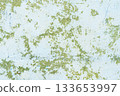 Peeling painted concrete wall, cracks of green blue and beige, peeling paint of the old rough concrete wall, peeling paint texture 133653997