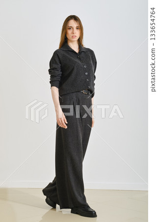Trendy female outfit for convenience and practicality in a modern indoor setting Trendy female outfit for convenience and practicality in a modern indoor setting 133654764
