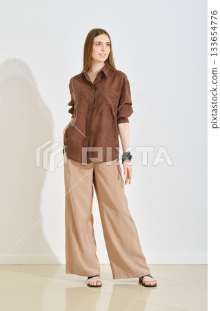 Trendy female outfit emphasizing comfort and practicality for a casual day out Trendy female outfit emphasizing comfort and practicality for a casual day out 133654776