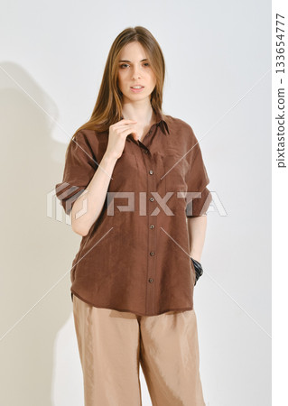 Trendy female outfit highlighting comfort and practicality for casual outings and everyday wear 133654777