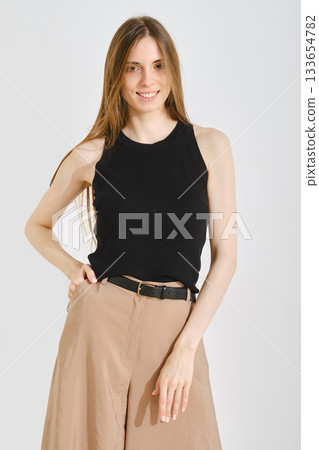 Trendy female outfit blends style with convenience for everyday wear in a modern setting 133654782