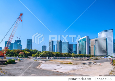 Tokyo cityscape in Japan: View of the Shiodome buildings and the former Tsukiji Market (6) including the temporary access road and removal of the upper structure of the loading pier 133655000
