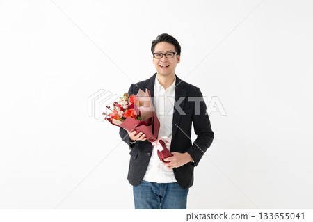 man holding a bouquet man holding a bouquet 133655041