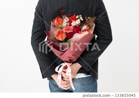 man holding a bouquet 133655045