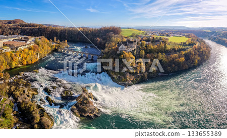 Panoramic aerial view of the Rhine Falls and Laufen Castle in Schaffhausen in autumn. Neuhausen, Canton of Schaffhausen, Switzerland Panoramic aerial view of the Rhine Falls and Laufen Castle in Schaffhausen in autumn. Neuhausen, Canton of Schaffhausen, Switzerland 133655389