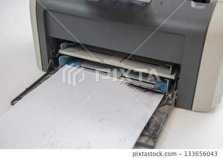 Broken laser printer cartridge on white background.  133656043