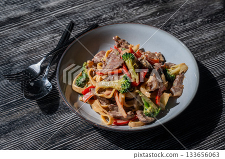 Pasta with beef, mushrooms and vegetables.  133656063