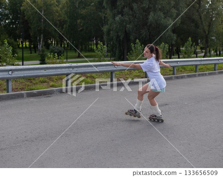 Caucasian woman in shorts roller skating. Caucasian woman in shorts roller skating. 133656509