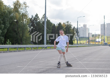 Caucasian woman in shorts roller skating. Caucasian woman in shorts roller skating. 133656513