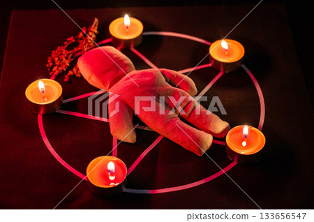 Voodoo doll on a pentagram. Witch spells. Voodoo doll on a pentagram. Witch spells. 133656547