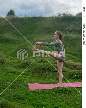 Caucasian woman doing yoga outdoors. Caucasian woman doing yoga outdoors. 133656813