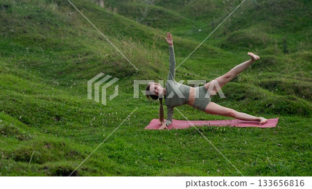 Caucasian woman doing yoga outdoors. Caucasian woman doing yoga outdoors. 133656816