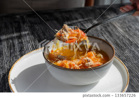 A bowl of shchi soup in a cafe. A bowl of shchi soup in a cafe. 133657226