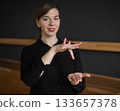 Woman showing the word center in Russian sign language.  133657378