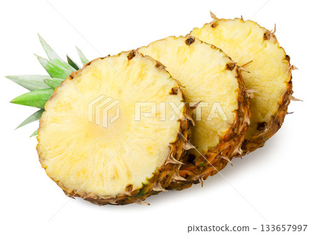 Pineapple pieces with leaves close-up on a white. Isolated Pineapple pieces with leaves close-up on a white. Isolated 133657997