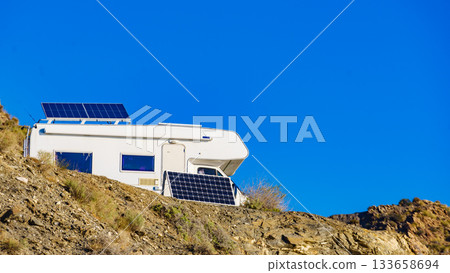 Caravan with tilt solar panels on roof. Caravan with tilt solar panels on roof. 133658694
