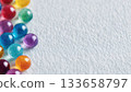 A gentle background texture made of scattered pastel beads 133658797