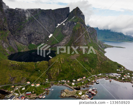 Mountain lake and Reine village, Lofoten islands Norway Mountain lake and Reine village, Lofoten islands Norway 133658920