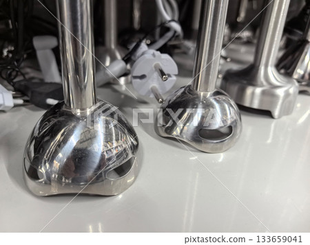 Unique kitchen gadgets displayed on smooth countertop in home appliance store 133659041