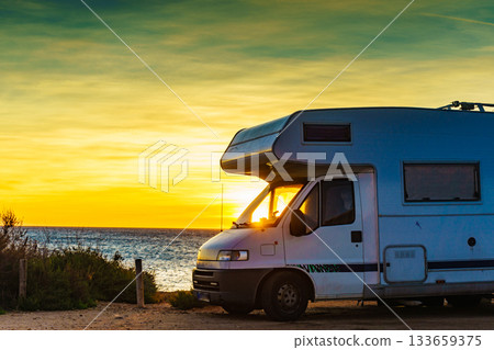 Camper car on beach at sunrise Camper car on beach at sunrise 133659375
