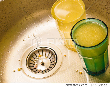Dirty dishes in kitchen sink 133659444