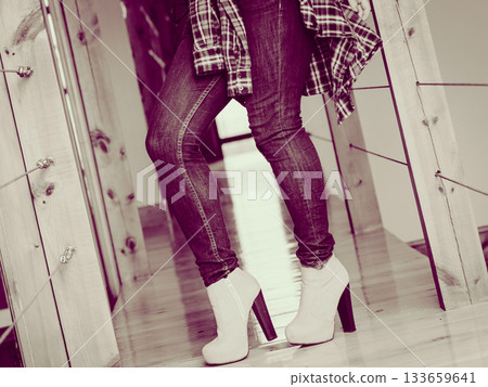 Woman wear casual clothes high heels indoor. 133659641