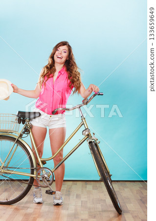 Woman with bike. Summer fashion and recreation. 133659649