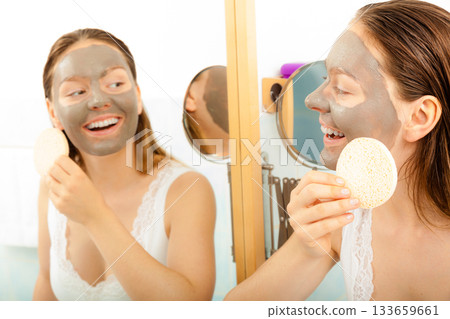 Woman face with mud facial mask 133659661