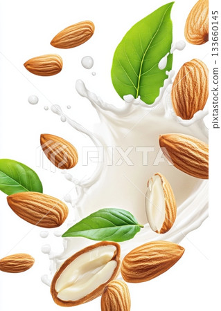 Creamy almond milk splashes with whole almonds and green leaves against a clean white background in dynamic motion 133660145
