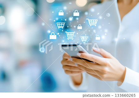 Woman engaged in online shopping using smartphone with animated shopping cart and discount icons illustrating modern e-commerce trends 133660265