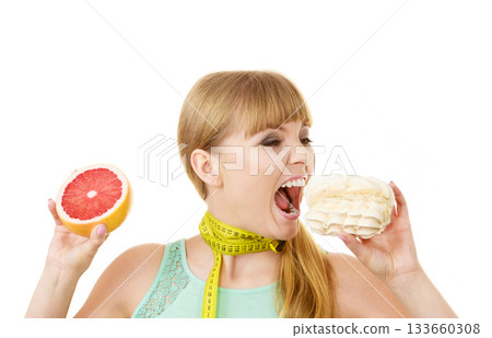 Woman choosing fruit or cake make dietary choice 133660308